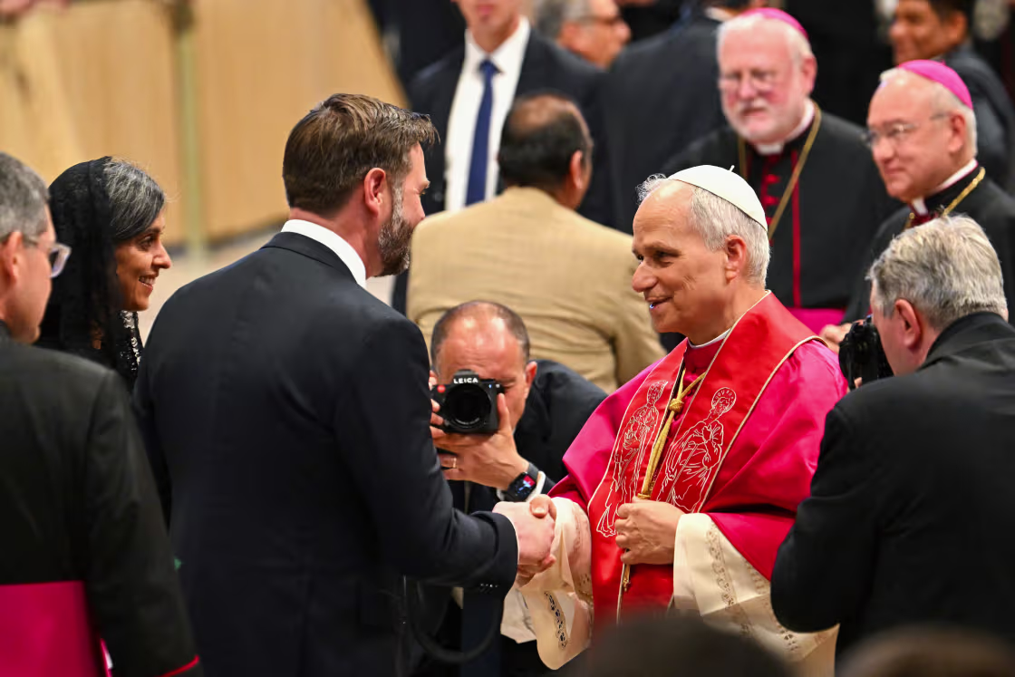 Pope Leo XIV talks to US Vice President JD Vance and his wife, Usha Vance, after his first inaugural Mass.