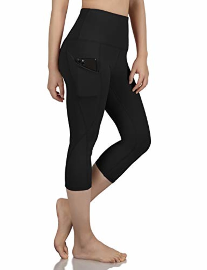 ODODOS Women&#039;s High Waist Yoga Capris with Pockets,Tummy Control,Workout Capris Running 4 Way Stretch Yoga Leggings with Pockets,Black,X-Small