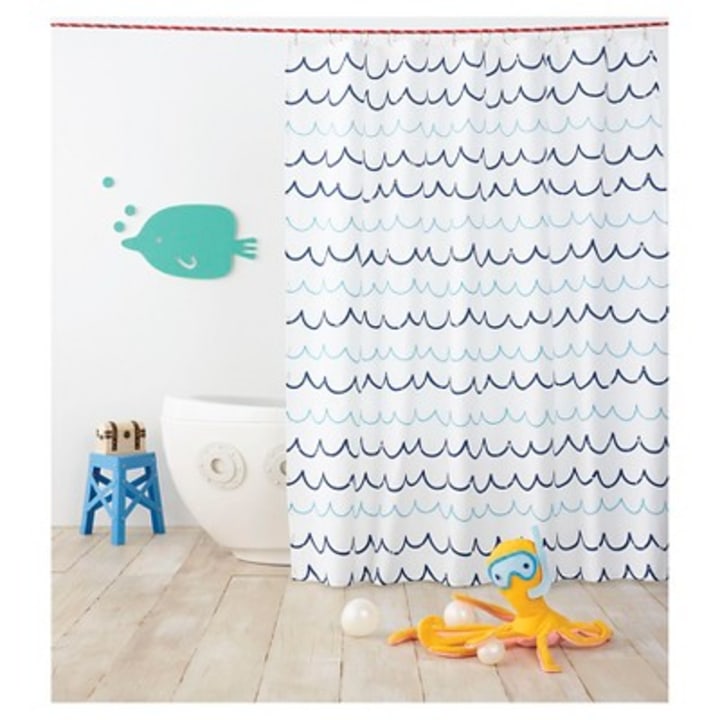 Instantly update your bathroom with the Pillowfort Wave Blue Shower Curtain. Sturdy construction and a whimsical pattern will provide a lasting, fun look, and the buttonhole top makes this shower curtain quick and easy to hang.