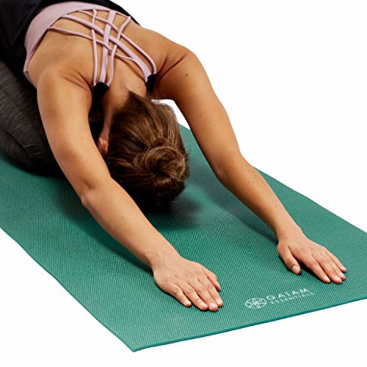 Gaiam Yoga Mat, Best yoga outfits and accessories, according to a personal trainer