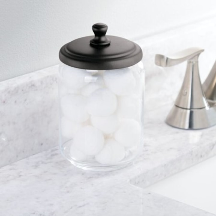mDesign Bathroom Vanity Glass Storage Organizer Canister Apothecary Jars for Cotton Swabs, Rounds, Balls, Makeup Sponges, Blenders, Bath Salts - 2 Pack, Clear/Bronze