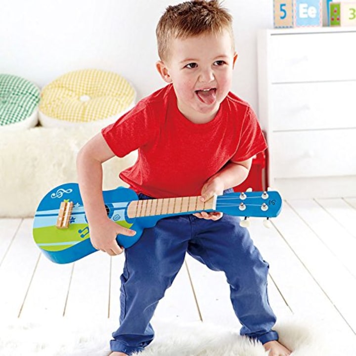 Hape Kid&#039;s Wooden Toy Ukulele in Blue, L: 21.9, W: 8.1, H: 3 inch