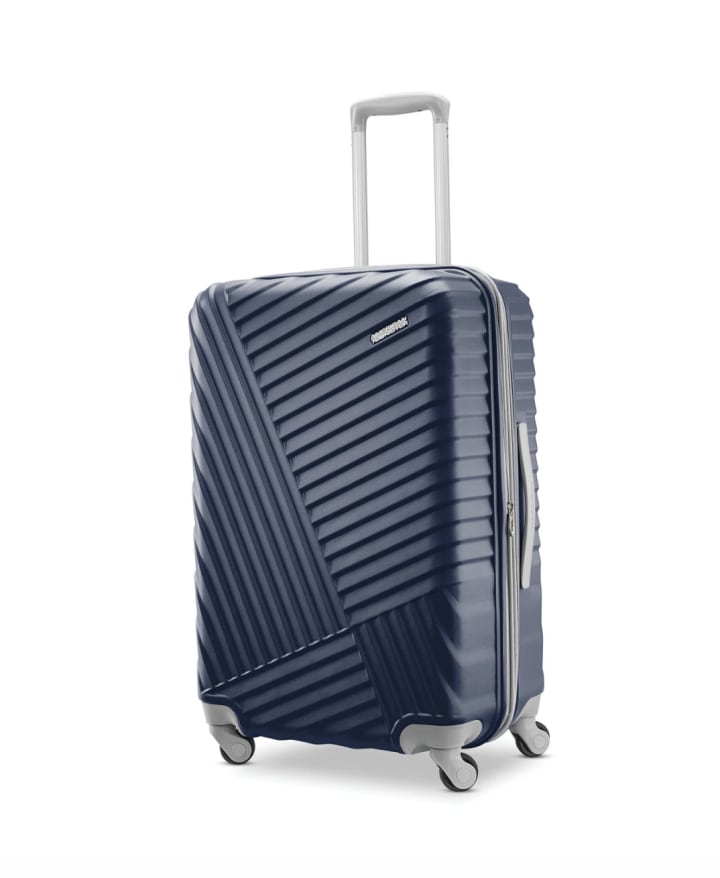 American Tourister Tribute DLX 24-Inch Spinner