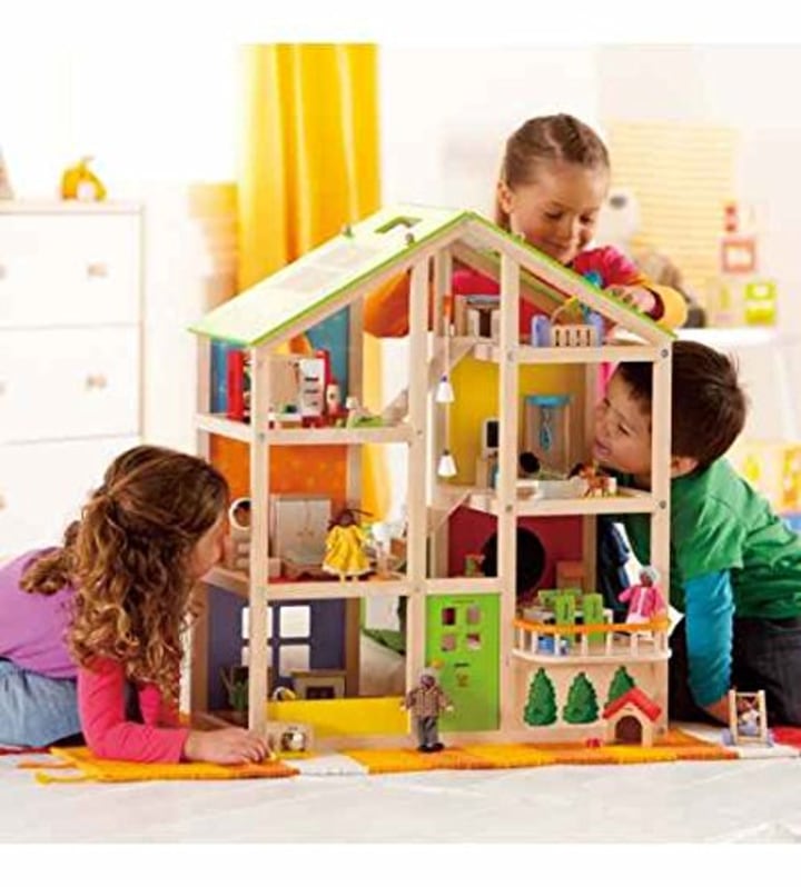 All Seasons Kids Wooden Dollhouse by Hape Award Winning 3 Story Dolls House Toy with Furniture, Accessories, Movable Stairs and Reversible Season Theme