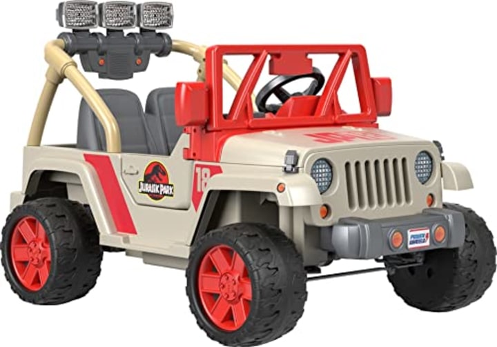 Power Wheels Jurassic Park Jeep Wrangler Kids Ride-on Car with Dinosaur Sounds and Functioning Light Bar, Seats 2