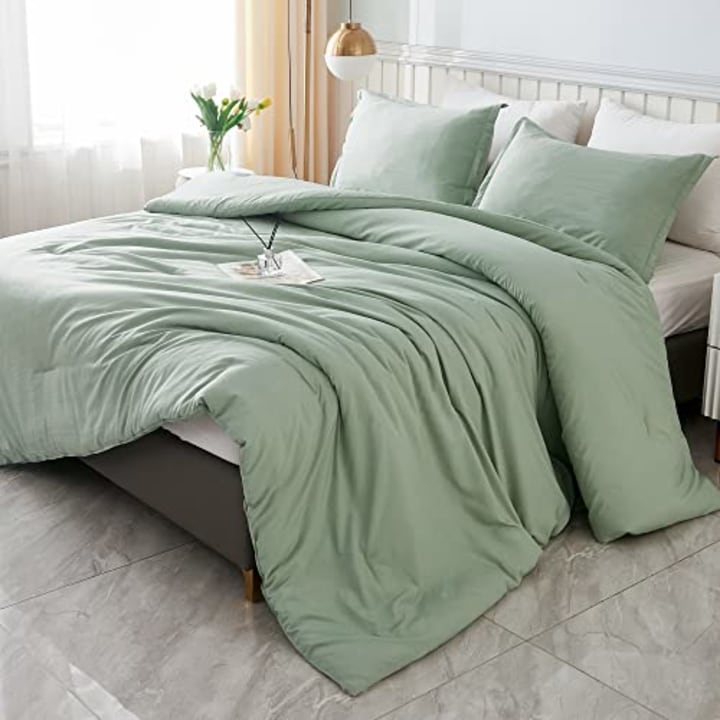 https://media-cldnry.s-nbcnews.com/image/upload/t_fit-720w,f_auto,q_auto:best/rockcms/2023-10/AMAZON-Litanika-King-Size-Comforter-Set-Sage-Green-3-Pieces-Boho-Bed-Lightweight-Solid-Bedding-Comforters--Sets-All-Season-Fluffy-Bed-Set-Quilt-Blanket-104x90In-Comforter--2-Pillowcases-0d9dae.jpg