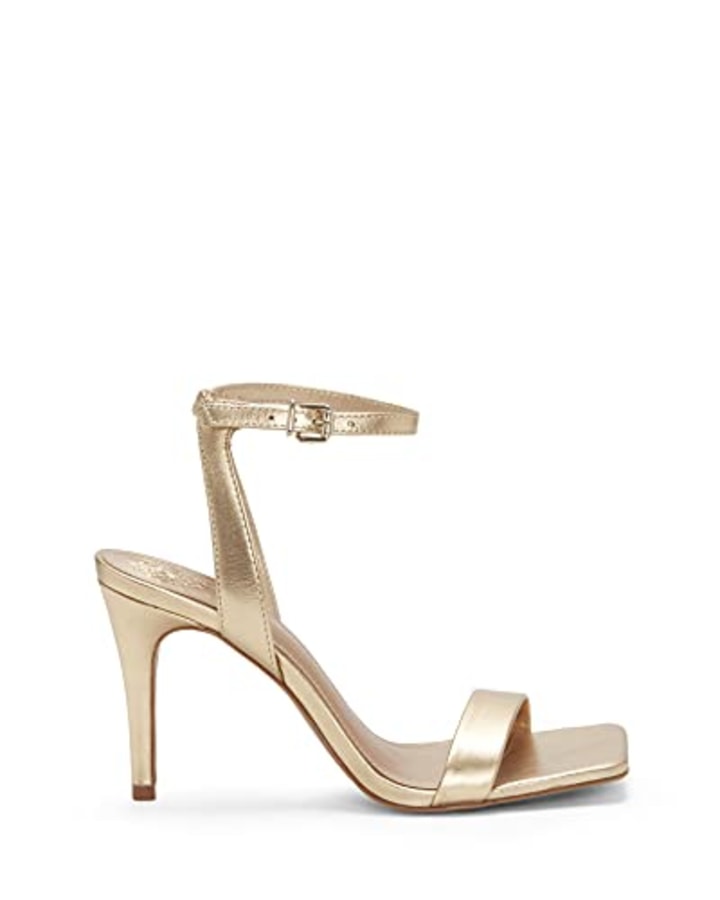 https://media-cldnry.s-nbcnews.com/image/upload/t_fit-720w,f_auto,q_auto:best/rockcms/2023-10/AMAZON-Vince-Camuto-Womens-Footwear-Womens-Saprenda-Heeled-Sandal-Egyptian-Gold-8-f79952.jpg