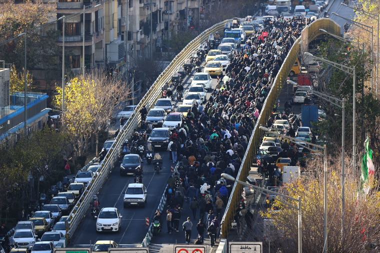 Iran security forces clash with protesters as death toll ...