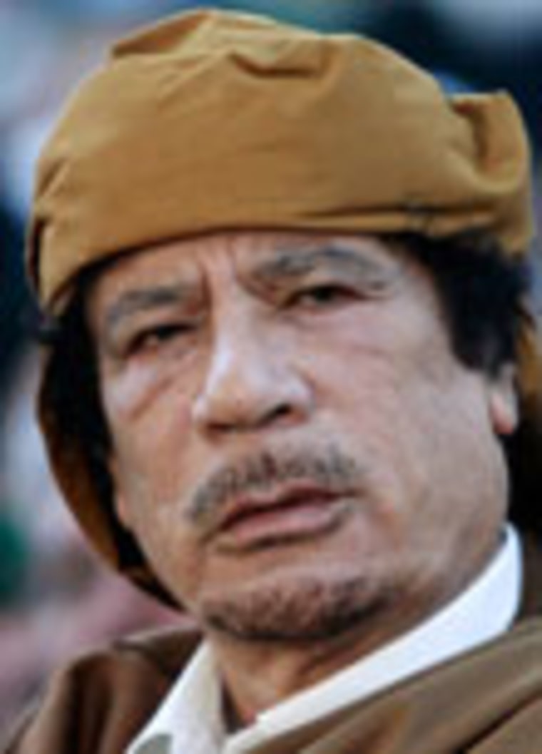 Image: Libyan leader Muammar Gaddafi attends a ceremony marking the birth of the Prophet Mohammed in Tripoli