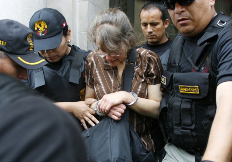 Berenson, a U.S. citizen jailed in Peru on terrorism charges, is escorted by police as she arrives in Lima