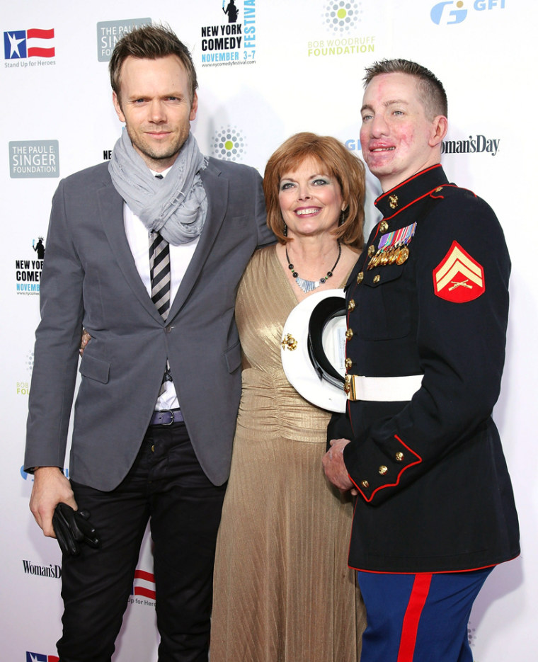 Image: Joel McHale at Stand Up for Heroes 2010 with retired Marine Cpl. Aaron Mankin, right, and his mother Diana Phelps