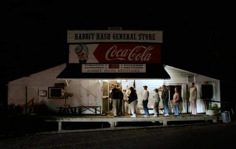 A line of voters extends out the door and across the porch of the Rabbit Hash General Store as the polls opened at 6 a.m. in Rabbit Hash, Ky., on Tuesday. Democrats say high voter turnout may help capture more GOP seats in the House of Representatives.
