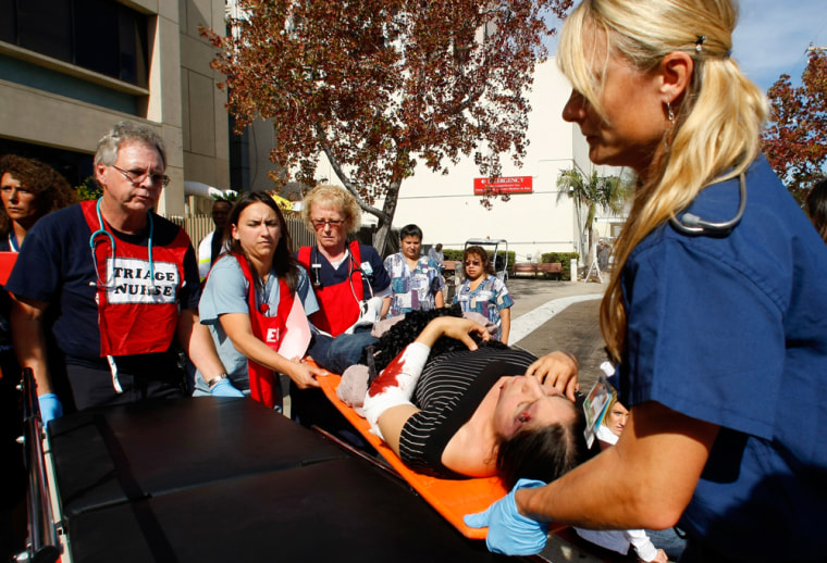 Image: Simulated earthquake victims arrive at an outdoor triage center during an earthquake drill at the University California San Diego Medial Center in San Diego