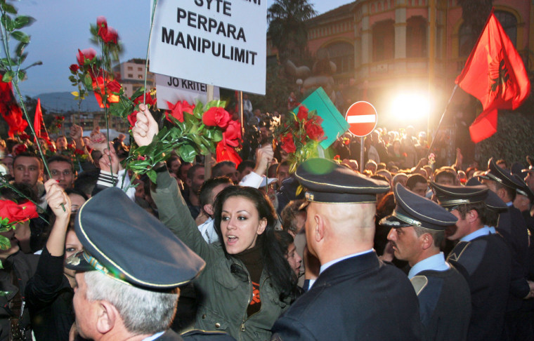 Image: Protesters shout slogans during a demonstration in Albania
