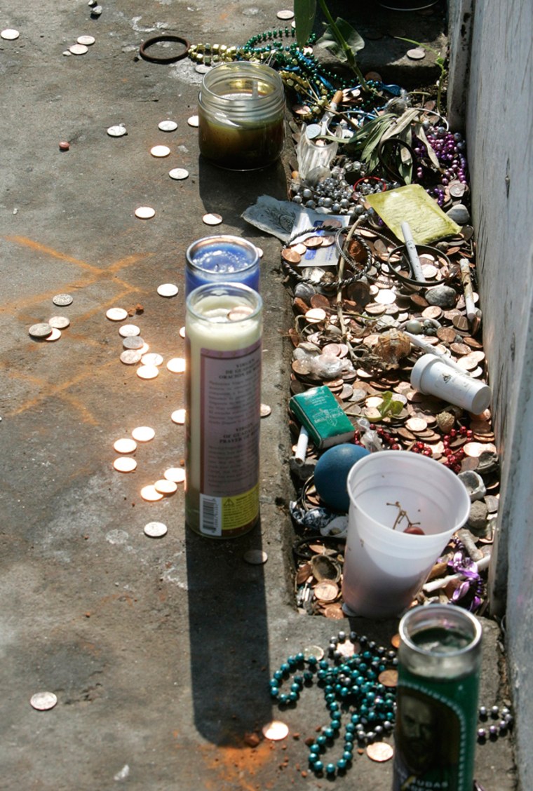 Offerings by visitors  to the tomb of famous voodoo queen Marie Laveau are show in front of the tomb in St. Louis No. 1 cemetery in New Orleans, Monday, Sept. 29, 2008.  (AP Photo/Bill Haber)