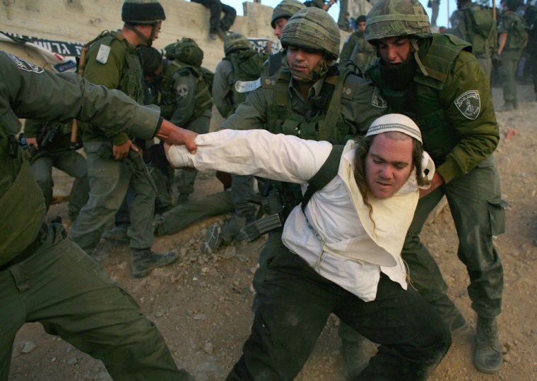 Image: Israeli police officers evict Jewish settler in Hebron