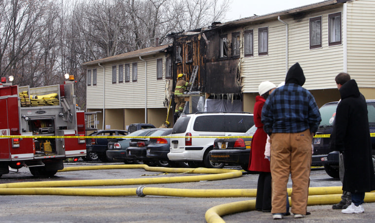 Firefighters work the scene of an Ohio blaze that killed five people early Saturday.