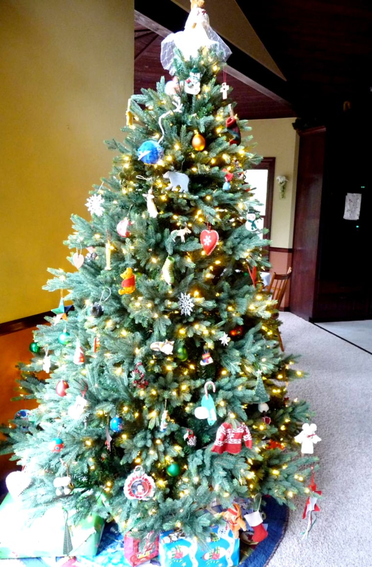 here's a photo of jason baer's fake xmas tree. he lives in flagstaff, arizona. he has two kids, 10 and 7, who fought him on getting this, but he just didn't want the hassle of a real tree anymore. after buying a real tree for the past 18 years since he's been out of college, he broke down for the first time this year and went faux.