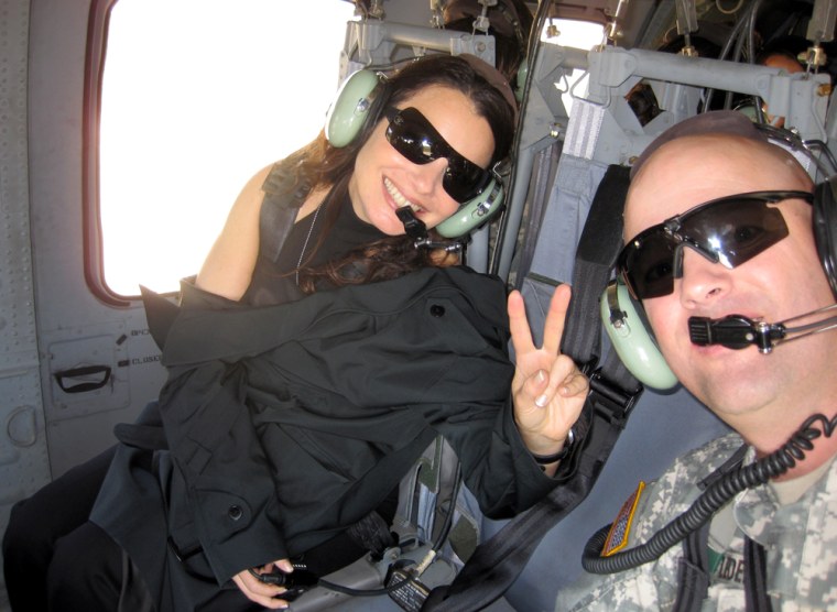 Image: Fran Drescher with soldier in a Black Hawk in Kosovo.