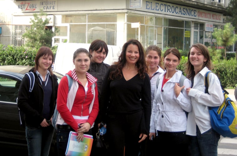 Image: Fran Drescher with students in Romania.