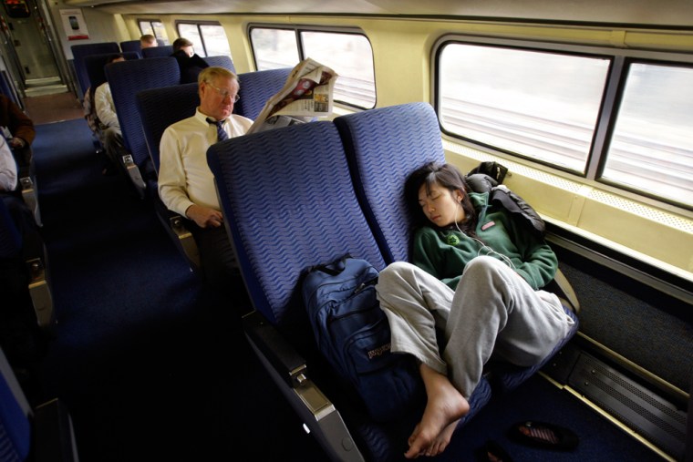 Image: Passengers relax while riding the train to Washington