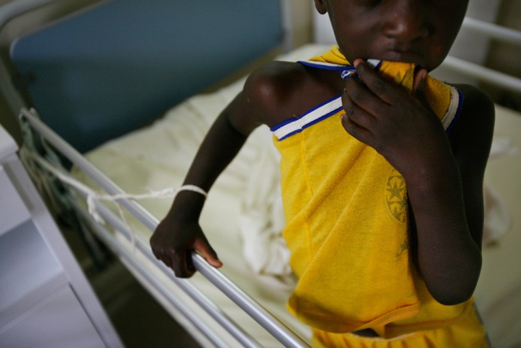 A 6-year-old boy suffering from neurological impairment due to lead poisoning is attached by a cord to his hospital bed as he undergoes long-term detoxification at a hospital in Thiaroye, Senegal Tuesday Sept. 9, 2008. After an unexplained illness killed 18 children in Thiaroye Sur Mer on the outskirts of the capital, authorities discovered that years of car battery recycling had left deadly levels of lead contamination in the soil. (AP Photo/Rebecca Blackwell)