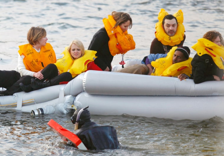 Image: Passengers are rescued after a U.S. Airways plane crashed into the Hudson River in New York