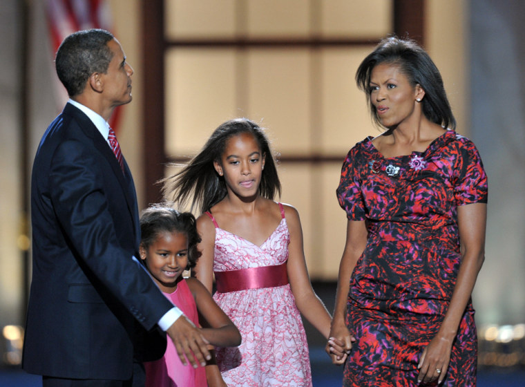 Image: Barack Obama, daughters Sasha (C-L) and Malia (C-R), and wife Michelle