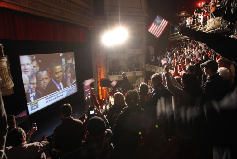 Image: People cheer at Apollo Theater in Harlem