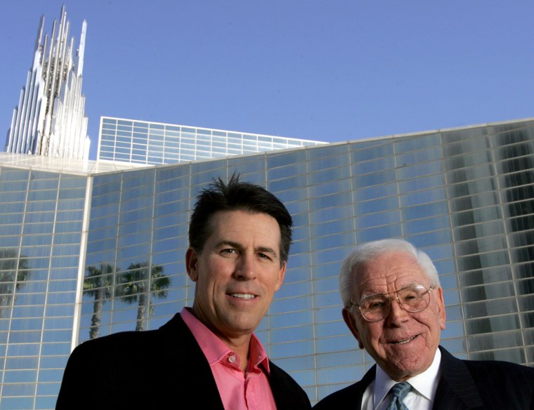 Image: Robert A. Schuller, left, poses for a photo with his father, Robert H. Schuller, outside the Crystal Cathedra