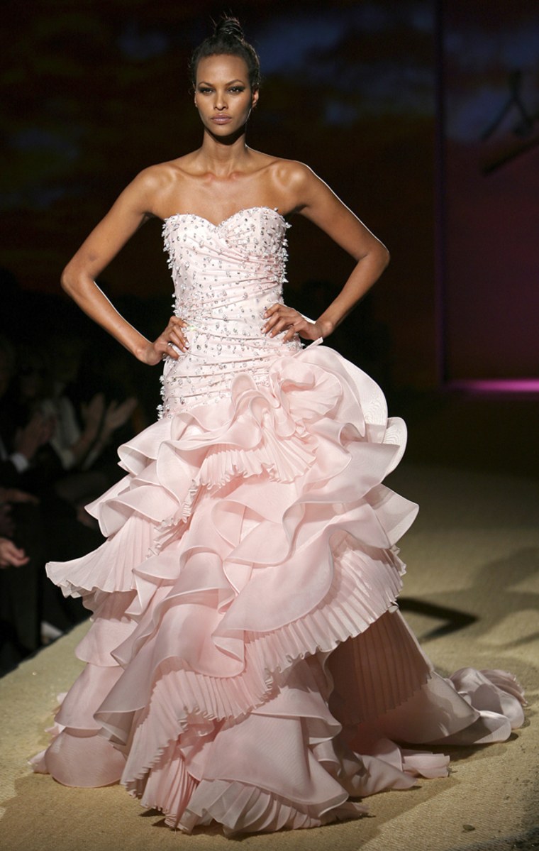 A model displays a creation by Italian designer Sarli dedicated to U.S. first lady Michelle Obamaduring a Rome Fashion Week Haute Couture Spring/Summer 2009 show