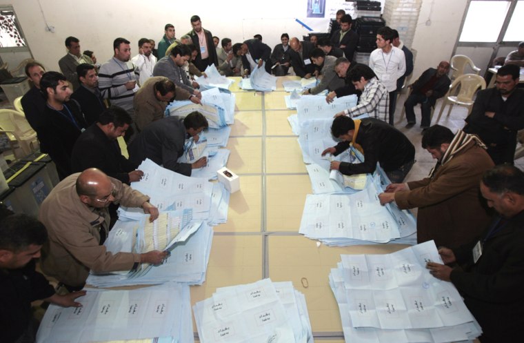 Image: Iraqi election officials count ballots