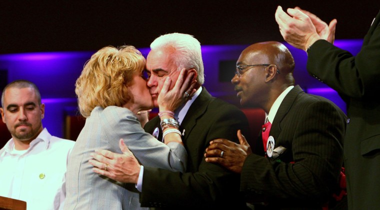 Image: George Anthony gets a kiss from his wife Cindy Anthony