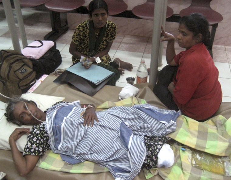 Image: A Tamil woman receives a treatment