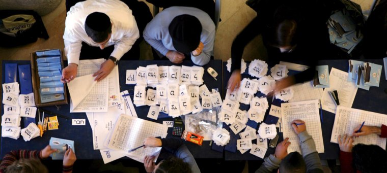 Image: teams of Israelis count votes