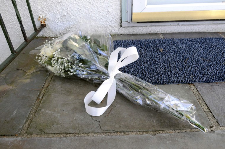 Image: Flowers left at the door of the Stamford, Conn. home of Sept. 11 widow Beverly Eckert