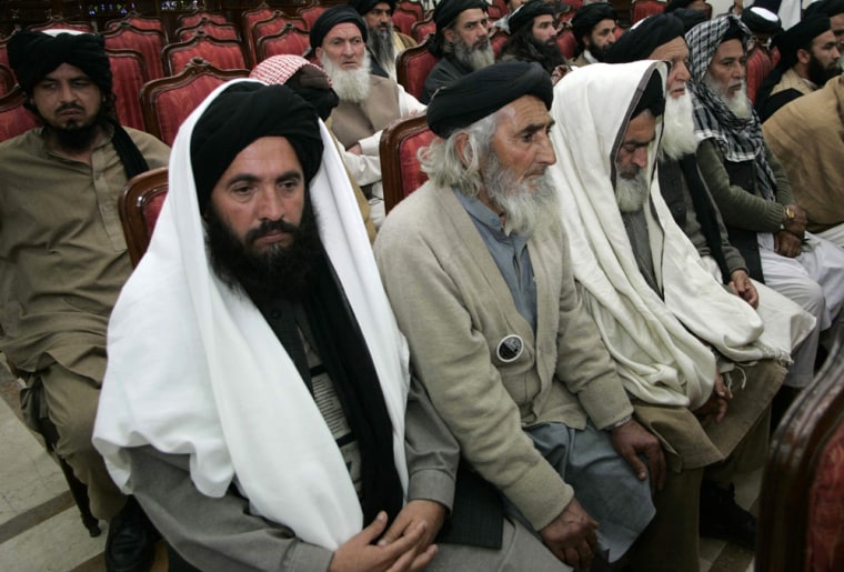 Image: Delegation members of Pakistani Islamist leader Soofi Mohammad attend a meeting in Peshawar