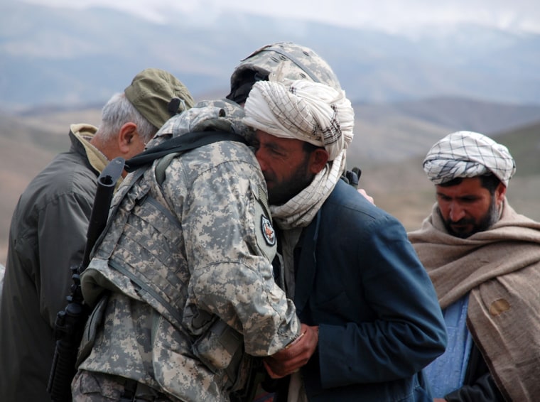 Image: rig. Gen. Michael A. Ryan, U.S. Forces Afghanistan, hugs a mournful Afghan man