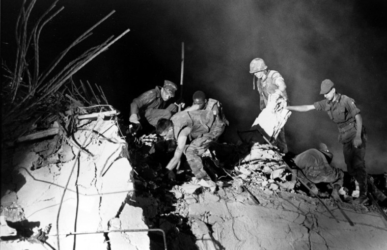 In this Oct. 24, 1983 file photo, U.S. Marines and an Italian soldier, right, dig through the rubble of the Battalion headquarters in Beirut, Lebanon, the scene of a suicide car bomb attack against the U.S. Marine barracks which occurred Sunday morning, Oct. 23, killing 241 servicemen. 