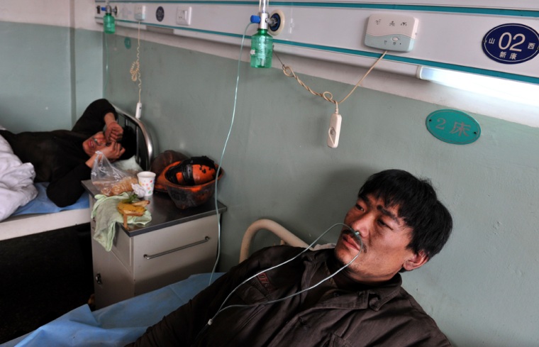 Rescued miners recuperate at a hospital on Sunday.  