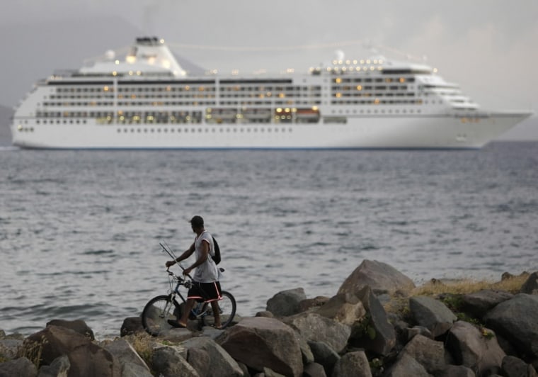A cruise ship departs the Caribbean island of St. Kitts. Three miles from shore, the cruise ships that flock to the Caribbean cross a boundary where they may flush solid waste overboard.