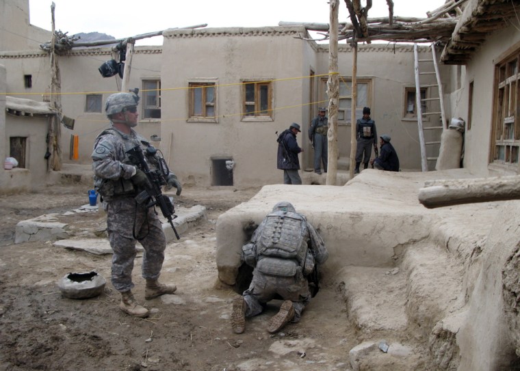 Image:  US soldiers search villages and farms in the area of Baraki Barak in Logar province
