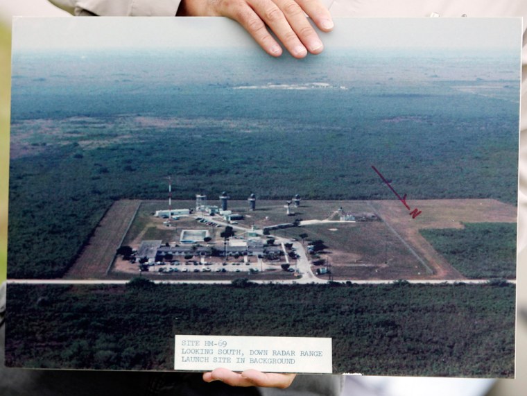 A National Park Service volunteer shows an undated photo of site HM-69, a Nike Hercules Missile Site, in the Florida Everglades. Now, tourists can join an hour-long driving tour to see the area. 