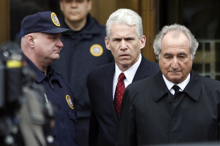 Image: Accused swindler Bernard Madoff exits the Manhattan federal courthouse