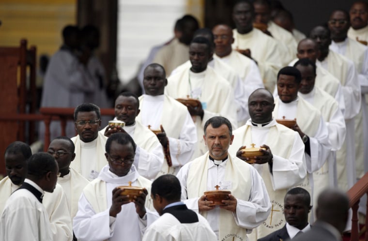 Image: Priests prepare to give communion to the faithful