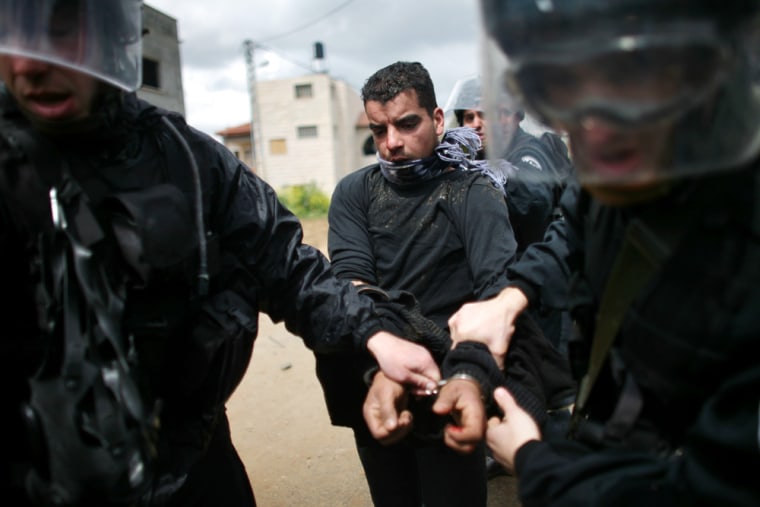 Image:A local Arab youth is arrested during clashes with Israeli police