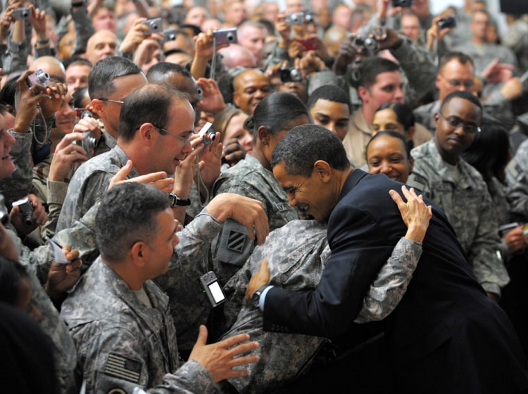 Image: Barack Obama greets troops during a visit to Camp Victory