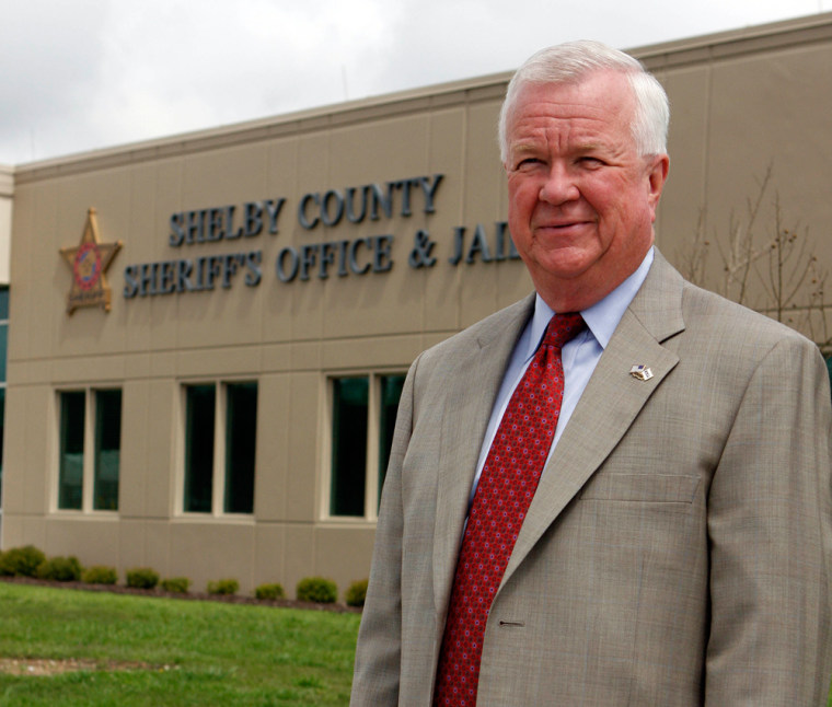 Shelby County Sheriff Chris Curry stands in front of the Sheriff's Office in Columbiana, Ala. on Thaursdy, April 2, 2009. Curry found out firsthand last Aug. 20 that the drug war, and the savagery it brings, had landed in his back yard with the brutal killing of five men at an apartment complex in Alabama's wealthiest county. (AP Photo/Butch Dill)
