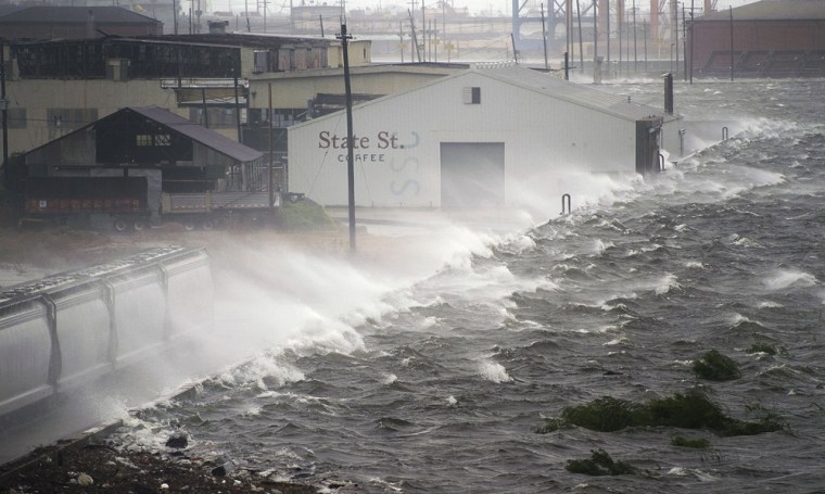 Image: Water splashes over a levee