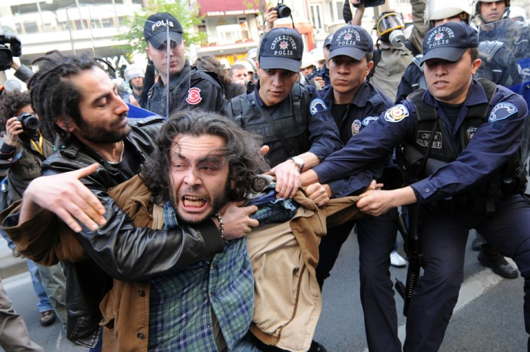 Image: Turkish riot police arrest a demonstrator